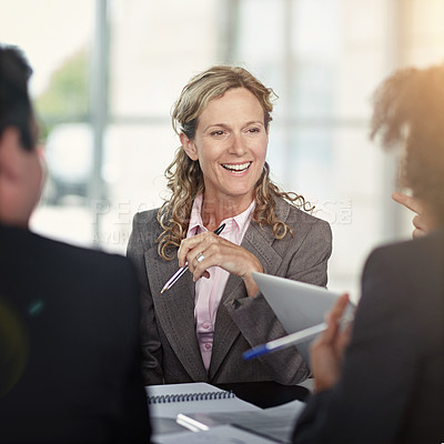 Buy stock photo Meeting, collaboration and planning with a business woman talking to her team around a boardroom table. Teamwork, strategy and our vision with a female manager in discussion with an employee group