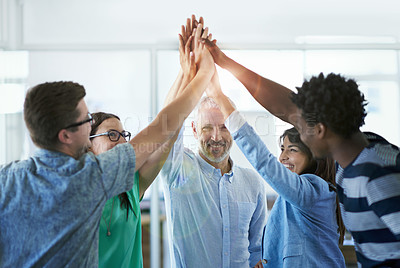Buy stock photo Cropped shot of a group of businesspeople high fiving