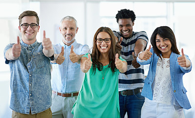 Buy stock photo Cropped portrait of a group of businesspeople giving the thumbs up