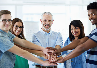 Buy stock photo Cropped shot of a creative business team in a huddle