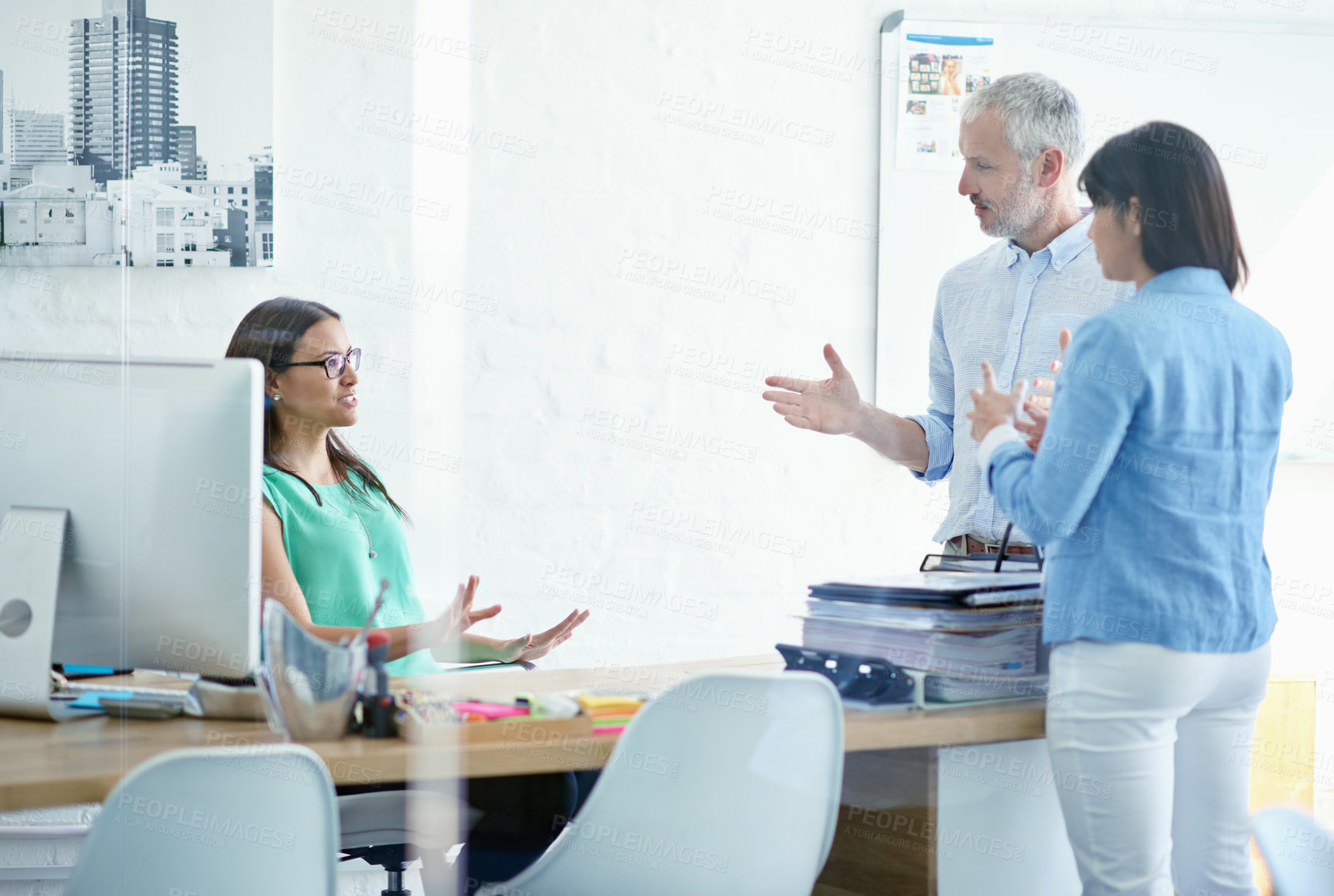 Buy stock photo Cropped shot of a mature businessman meeting with his creative team