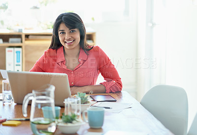 Buy stock photo Cropped portrait of a female designer working on a creative project at her desk