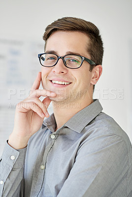 Buy stock photo Cropped shot of a smiling young businessman in his office