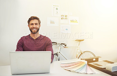 Buy stock photo Cropped portrait of a young architect working on his latop