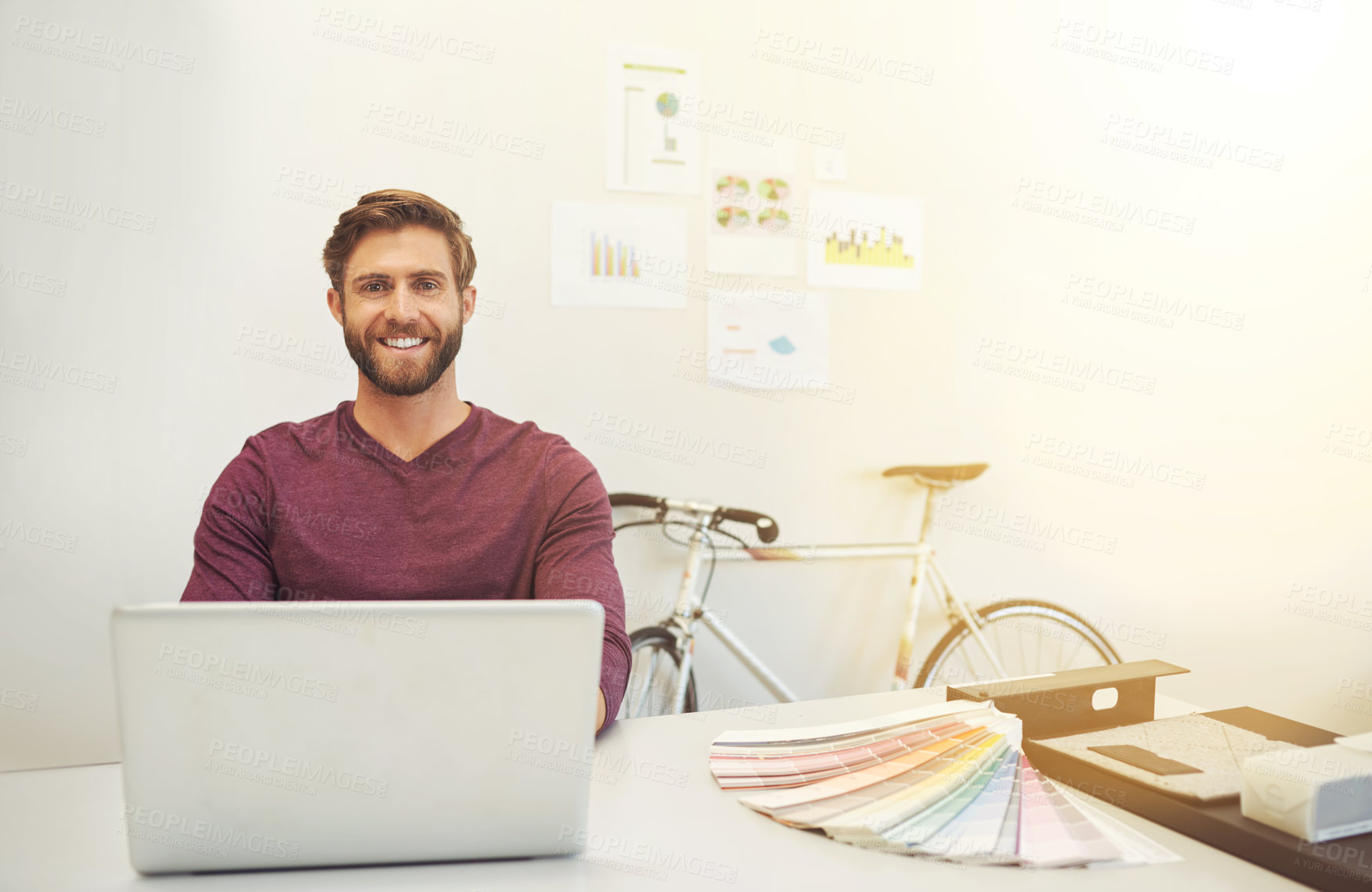 Buy stock photo Cropped portrait of a young architect working on his latop