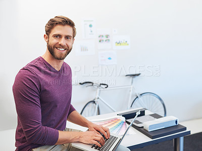 Buy stock photo Cropped portrait of a young architect working on his latop