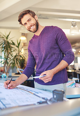 Buy stock photo Cropped portrait of a young architect working on his drafting table