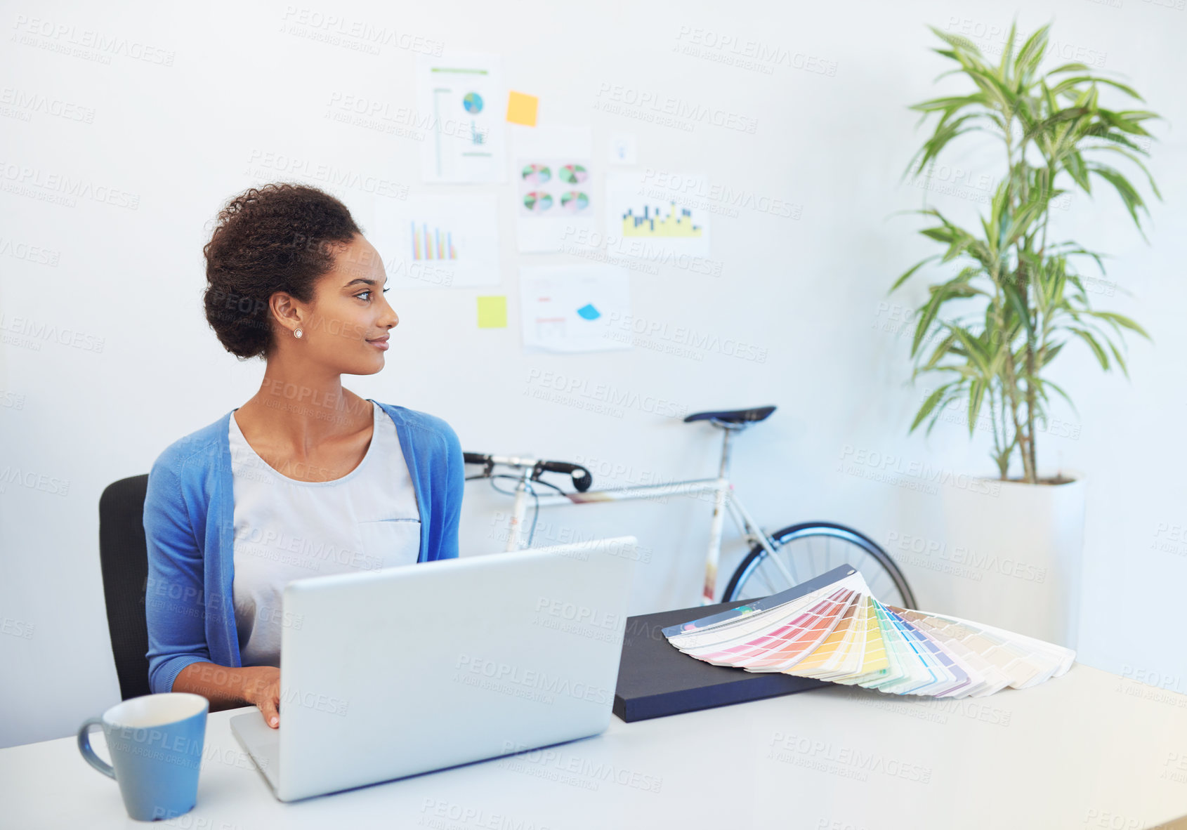 Buy stock photo Cropped shot of a young architect working on her laptop