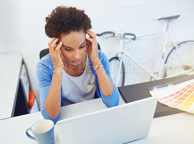 Buy stock photo Cropped shot of a frustrated young architect working on her laptop