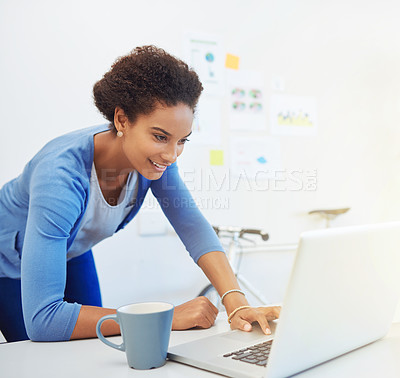 Buy stock photo Cropped shot of a young architect working on her laptop
