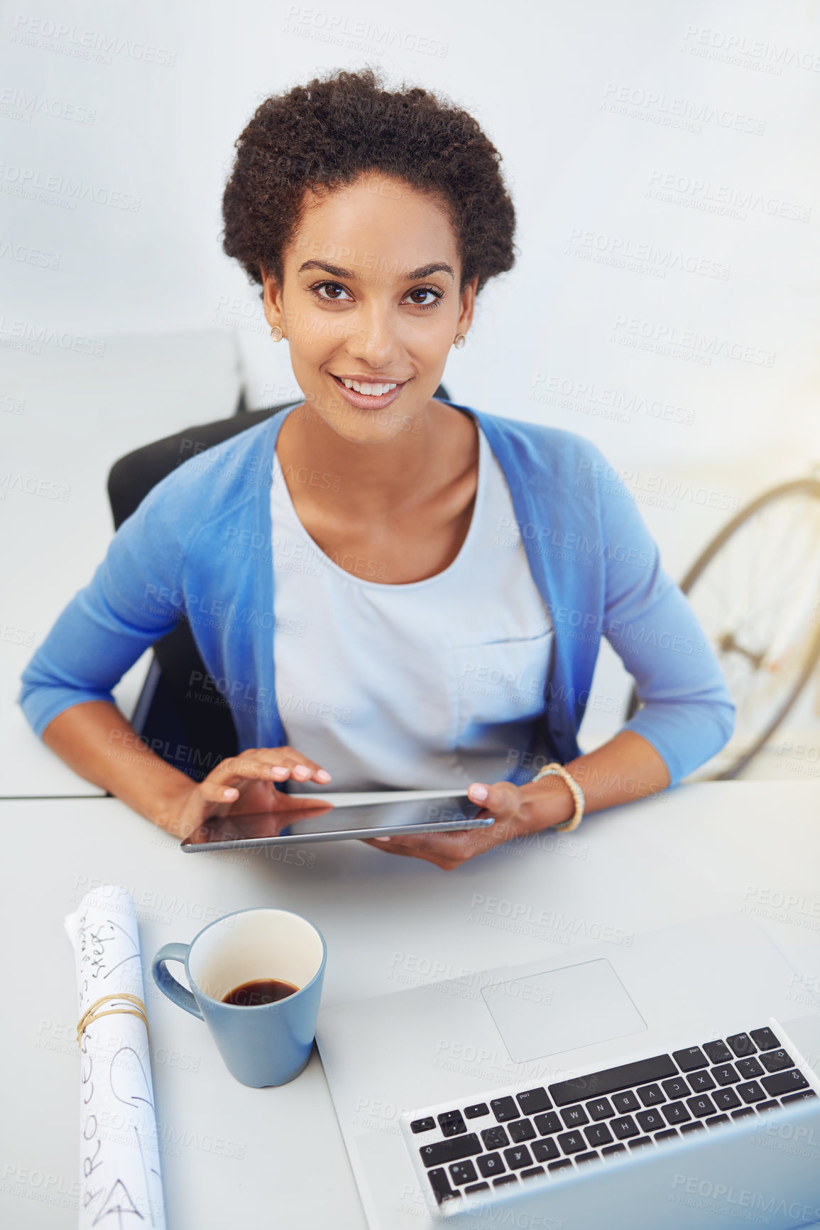 Buy stock photo Cropped portrait of a young architect working on her laptop and tablet