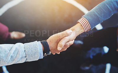 Buy stock photo Closeup shot of two businesspeople shaking hands