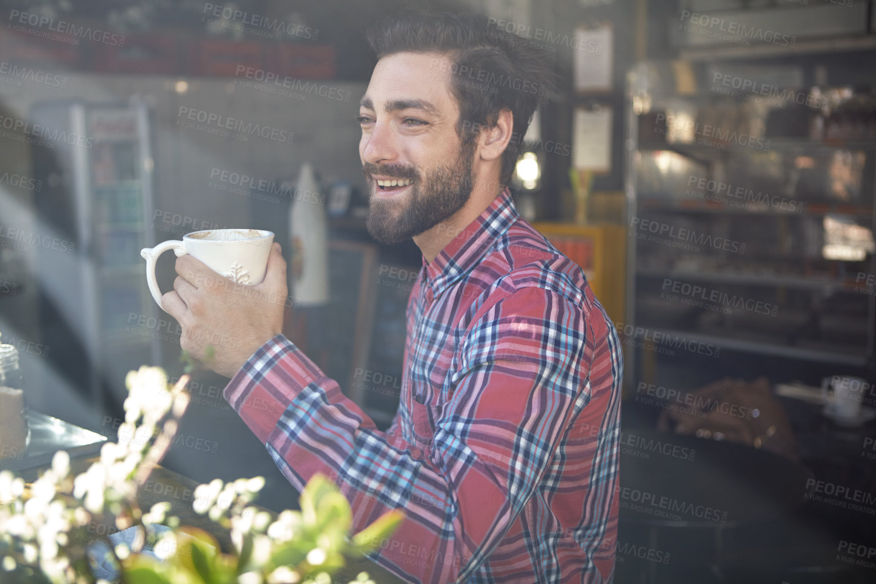 Buy stock photo Shot of a young man drinking coffee in a cafe