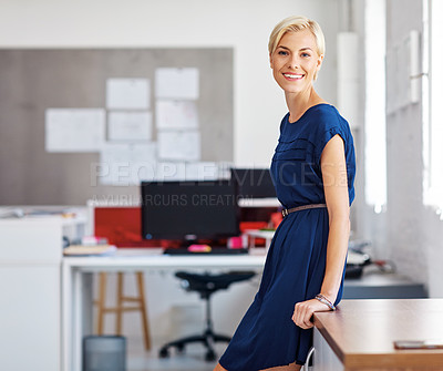 Buy stock photo Cropped portrait of a young businesswoman standing in her office
