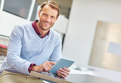 Buy stock photo Cropped portrait of a mature businessman working on his tablet in the office
