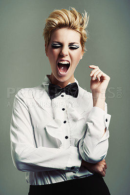 Buy stock photo Portrait, bow tie or crazy woman with fashion, vintage clothes and classy aesthetic on grey background. Screaming, edgy fashionable model or cool girl with retro style and makeup isolated in studio