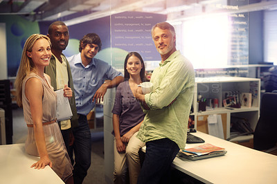 Buy stock photo Cropped portrait of a group of businesspeople standing in their office