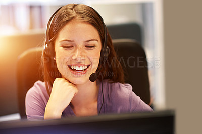 Buy stock photo Cropped shot of a young businesswoman wearing a headset at her desk