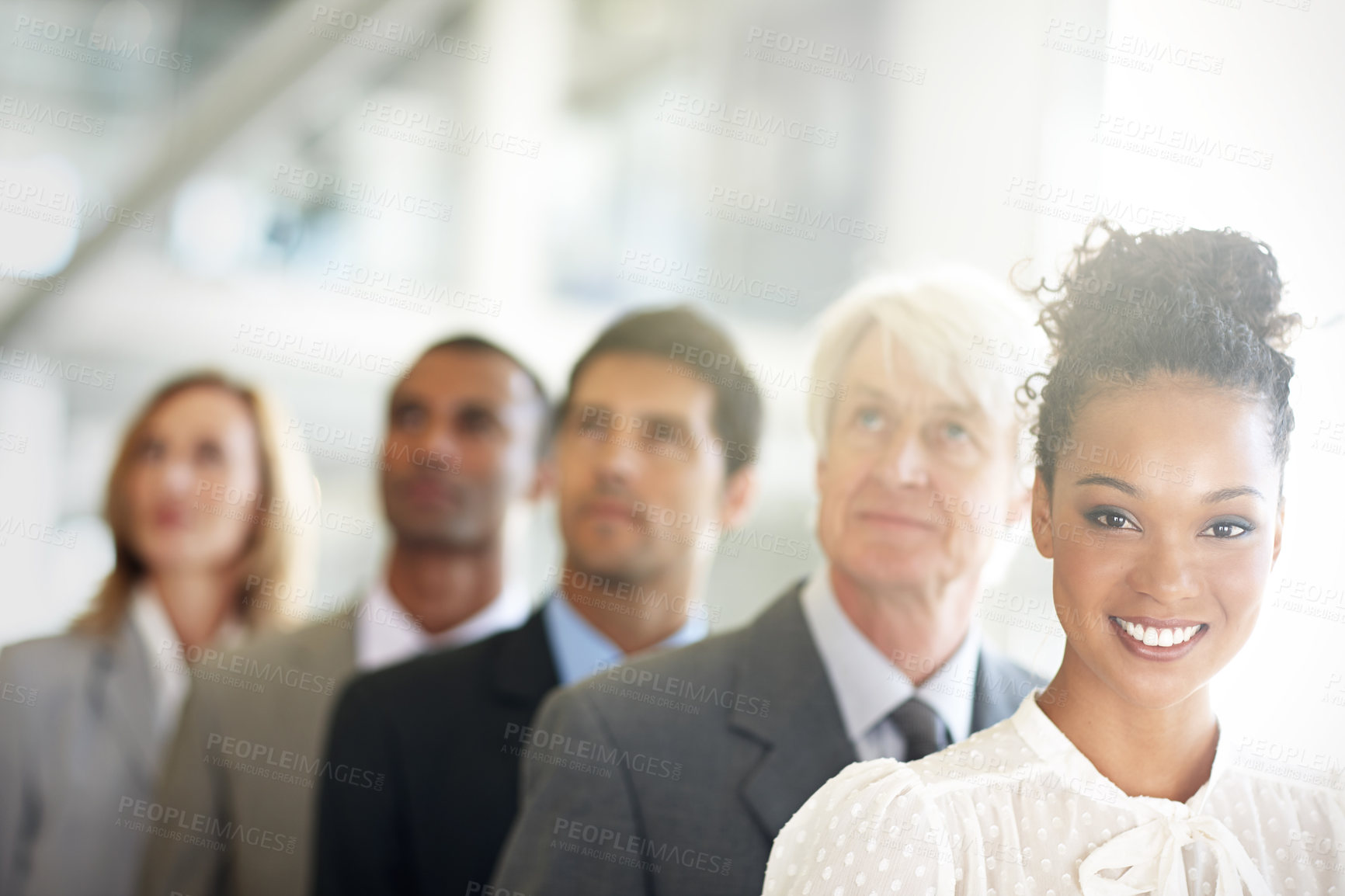 Buy stock photo Cropped shot of a group of diverse businesspeople standing in a line