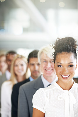 Buy stock photo Portrait, leadership and a business black woman manager at the from of a queue in her corporate office. Smile, management and a happy female leader standing in line with a team following her vision