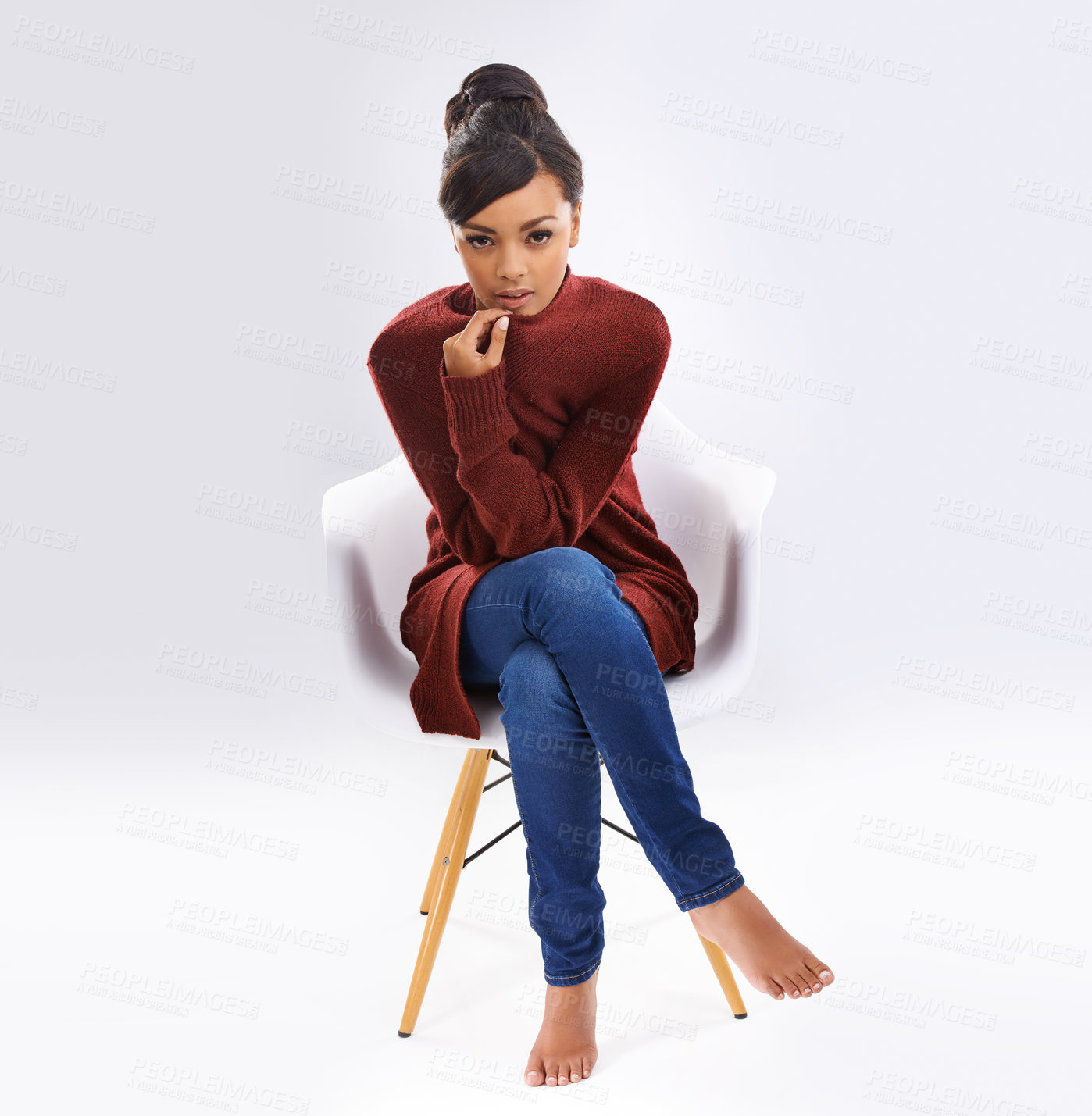 Buy stock photo Fashion, confident and portrait of woman in studio with casual, trendy and stylish outfit for winter. Serious, chair and female person from Colombia with clothes for cold season by white background.
