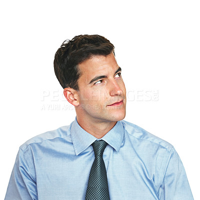 Buy stock photo Studio shot of a young businessman looking thoughtful against a white background