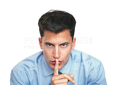 Buy stock photo Studio portrait of a young businessman with his finger on his lips isolated on white