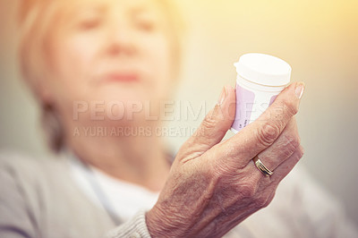 Buy stock photo Medicine, hands and woman with bottle of pills for recovery, health and wellness. Closeup, elderly patient and reading label on medication container of prescription tablets, supplements and vitamins