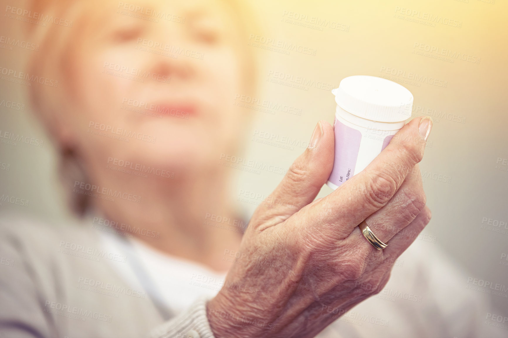 Buy stock photo Medicine, hands and woman with bottle of pills for recovery, health and wellness. Closeup, elderly patient and reading label on medication container of prescription tablets, supplements and vitamins