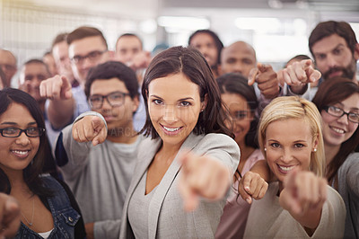 Buy stock photo Portrait of a group of smiling businesspeople pointing at the camera