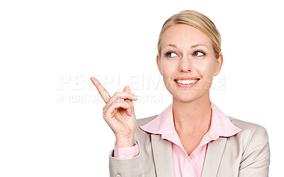 Buy stock photo Studio shot of a businesswoman pointing towards copyspace against a white background