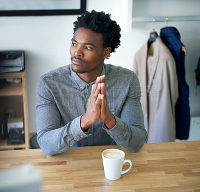 Buy stock photo Business, thinking and black man with coffee, hands together and planning with problem solving. African person, employee and consultant with creativity, fashion designer and inspiration with solution