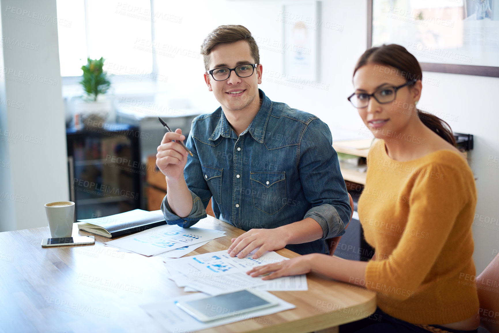 Buy stock photo Portrait of two colleagues working together on a creative project