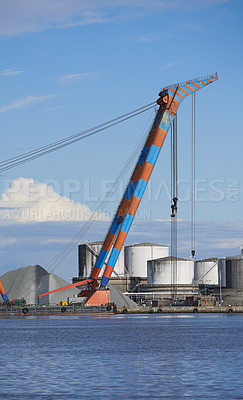 Buy stock photo Logistics, harbor and industrial crane at port for cargo transport, delivery or distribution. Empty, shipping and machine for supply chain, steel manufacturing or infrastructure at export factory