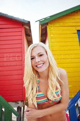 Buy stock photo Shot of a young woman in a bikini at the beach