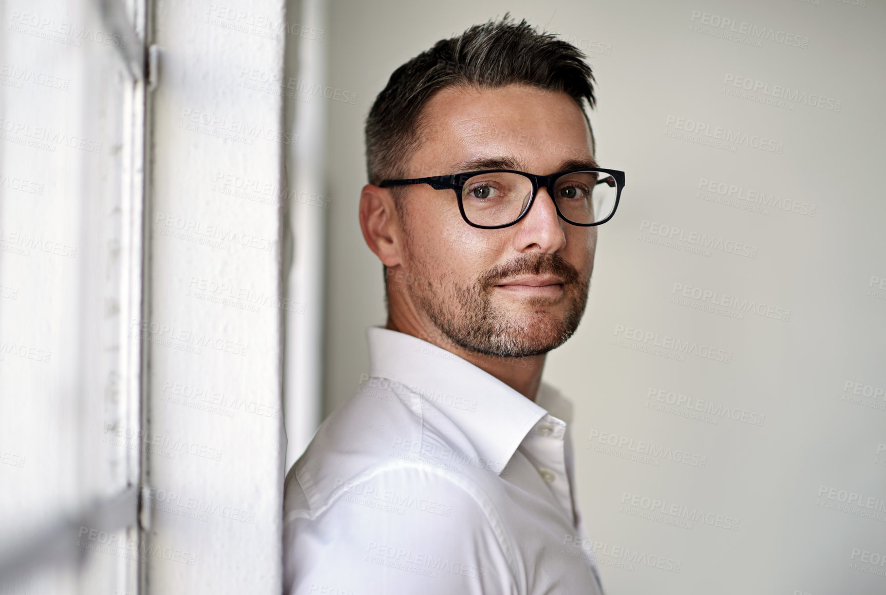 Buy stock photo Cropped portrait of a businessman standing in his office