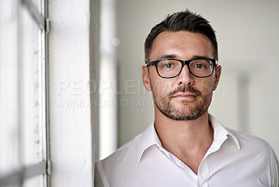 Buy stock photo Cropped portrait of a businessman standing in his office