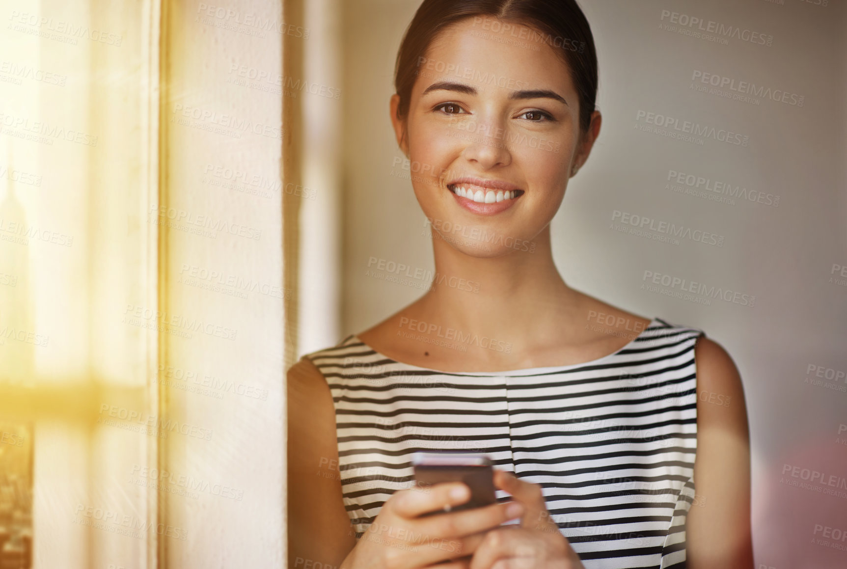 Buy stock photo Cropped portrait of a businesswoman sending a text in her office