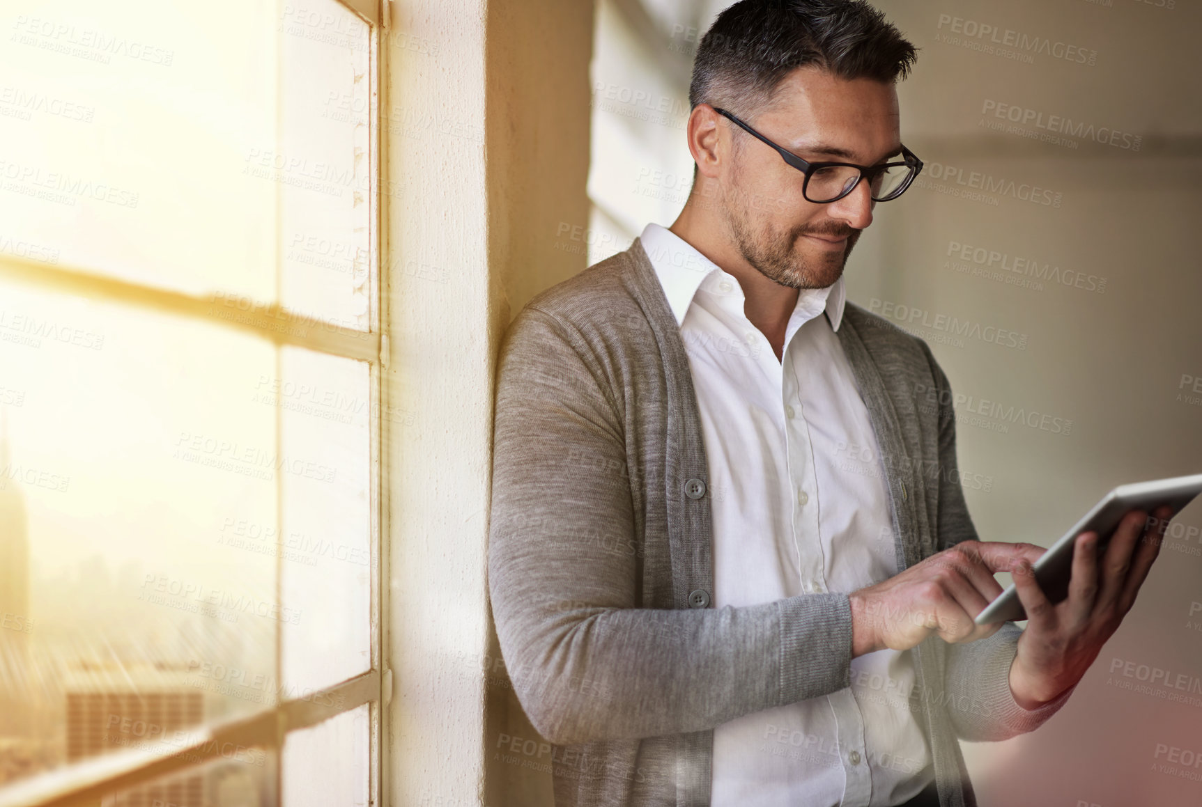 Buy stock photo Business man, tablet and reading by window with email alert, communication and networking in office. Accountant guy, typing and digital for economy news, stock market forecast and investment website