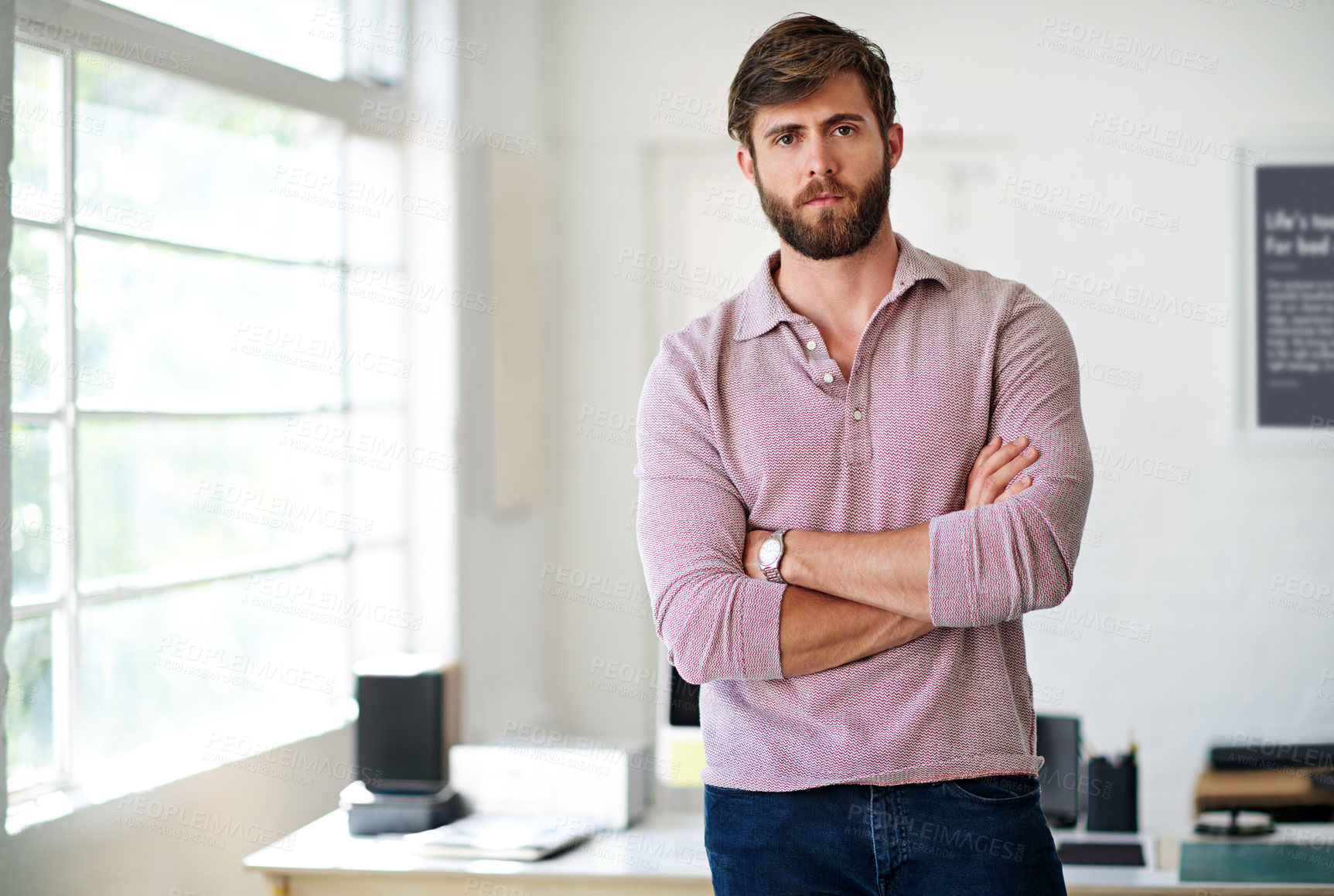 Buy stock photo Cropped portrait of a businessman standing with his arms folded in the office