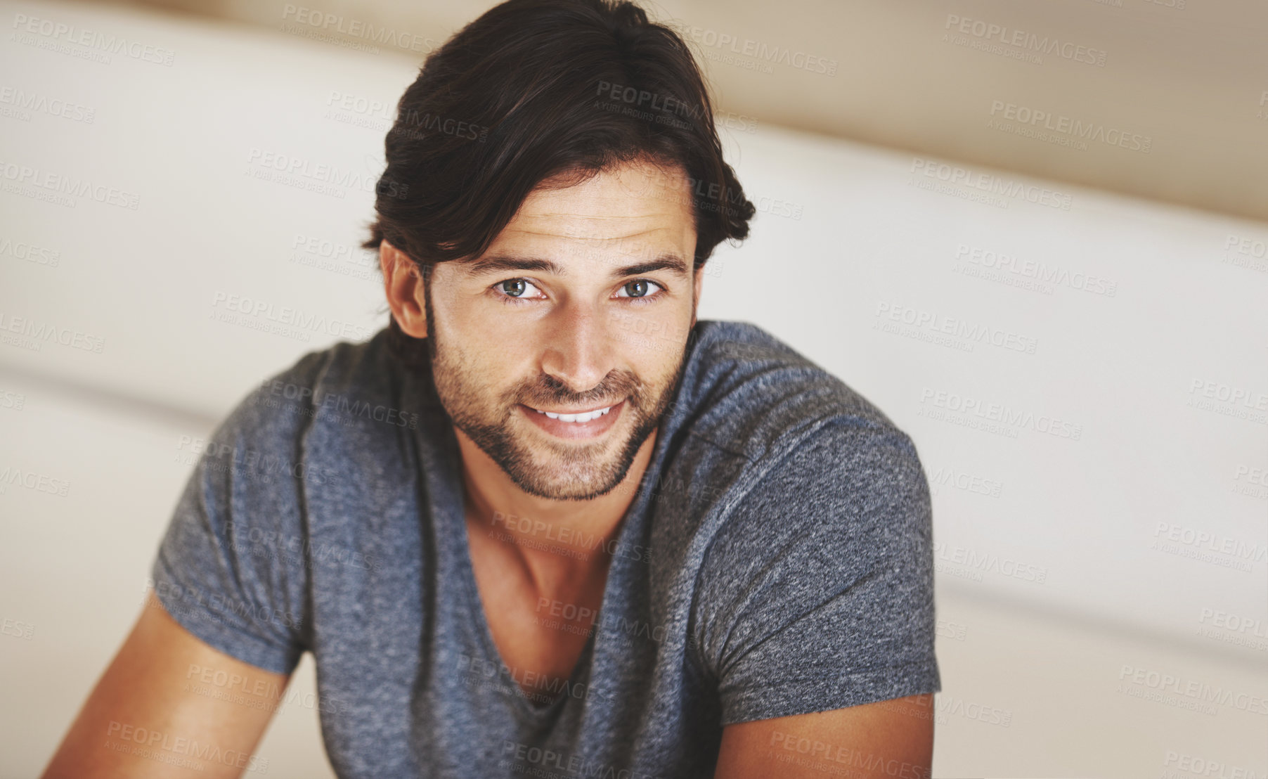 Buy stock photo A handsome young man at home