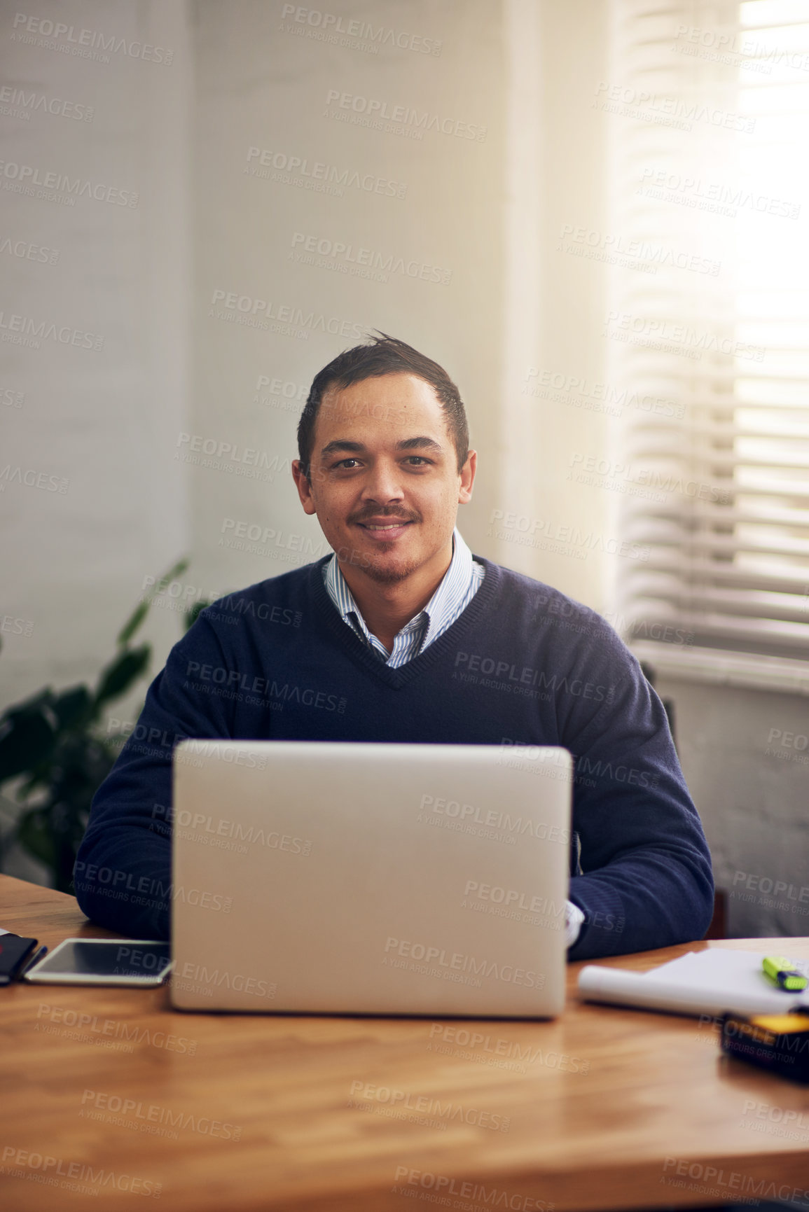 Buy stock photo Happy, laptop and portrait of business man in office for communication, email or search web. Lens flare, professional and employee with computer for planning, agenda or typing report in workplace