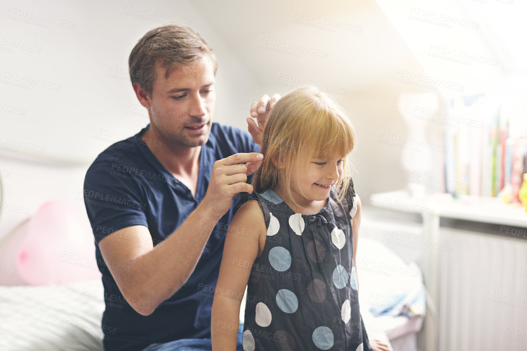Buy stock photo Father, daughter and helping with hair or happiness on bed in bedroom of home for support and love. Family, man and girl child with smile, hairstyle and haircare for parenting, care and relationship