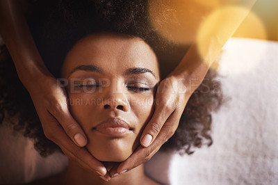Buy stock photo Woman, relax and massage on face with hands and care for facial, wellness and spa treatment on bed. Above, lens flare and african female person with skincare and cosmetics at hotel with skin glow 