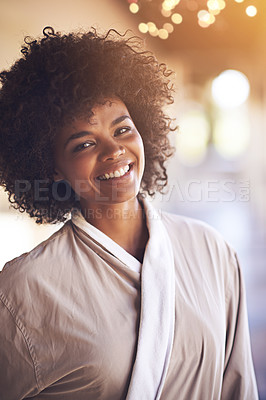 Buy stock photo Spa, woman and portrait with smile in a bathrobe for wellness, cosmetics and beauty treatment. Health, skincare and resort with an African female person ready for dermatology at a hotel with bokeh