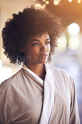 Buy stock photo Spa, woman and thinking with skin care in a bathrobe for wellness, cosmetics and beauty treatment. Health, calm and resort with an African female person ready for dermatology at a hotel with a idea