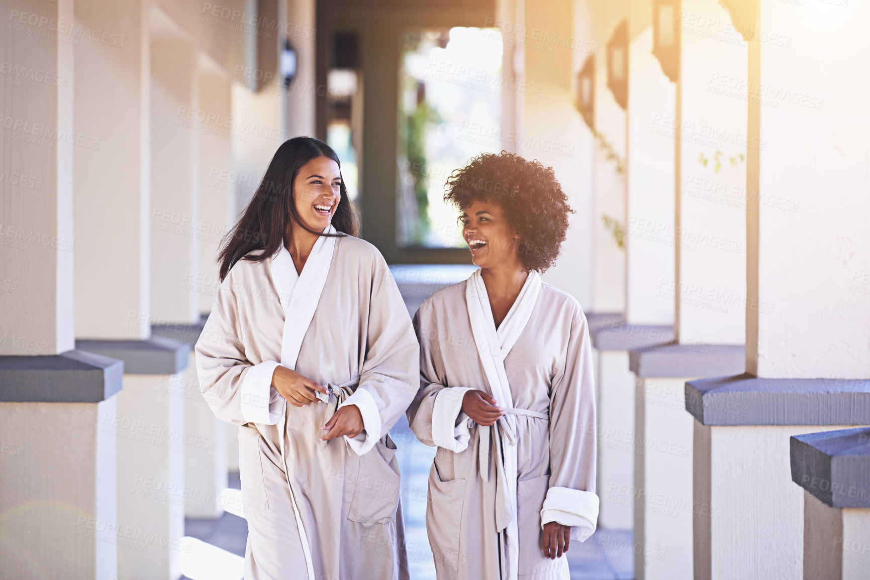 Buy stock photo Shot of two young women enjoying a relaxing day at the spa