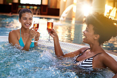 Buy stock photo Happy woman, friends and relax with drinks in jacuzzi at hotel, resort or hot tub spa together. Face of female person or people smile with glass of champagne for relaxation, hospitality or vacation