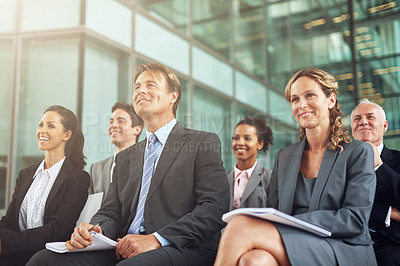 Buy stock photo Business, group and seminar listen at an agency with a smile in the audience to learn. Professional, listening and together at a conference to plan a project during a conversation in the company.