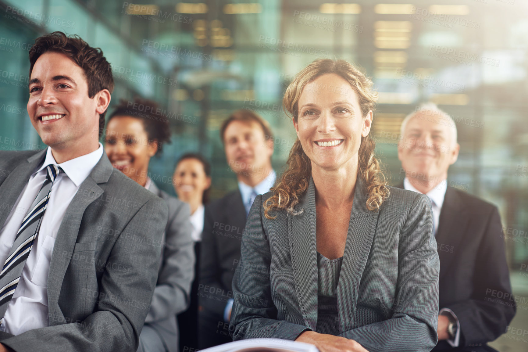 Buy stock photo Cropped shot of a group of businesspeople sitting in a presentation